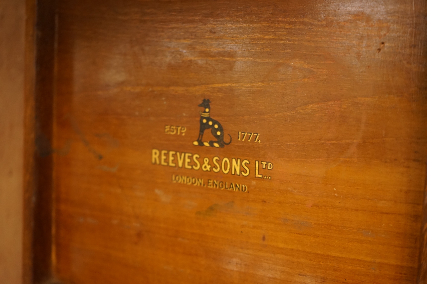 A 20th century Reeves and Sons Ltd artists box with ceramic palette and the remains of paint, 25cm wide